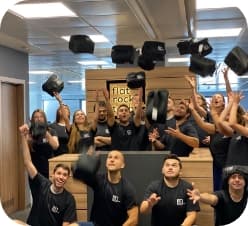 team of people throwing bags in the air